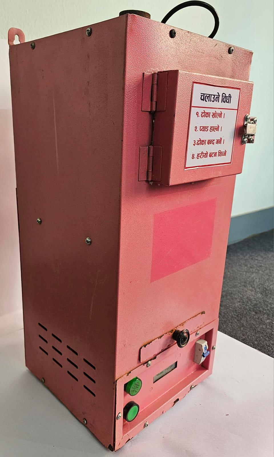 Side-angle view of a pink electric sanitary pad incinerator box highlighting the hinged disposal chamber door and latch.