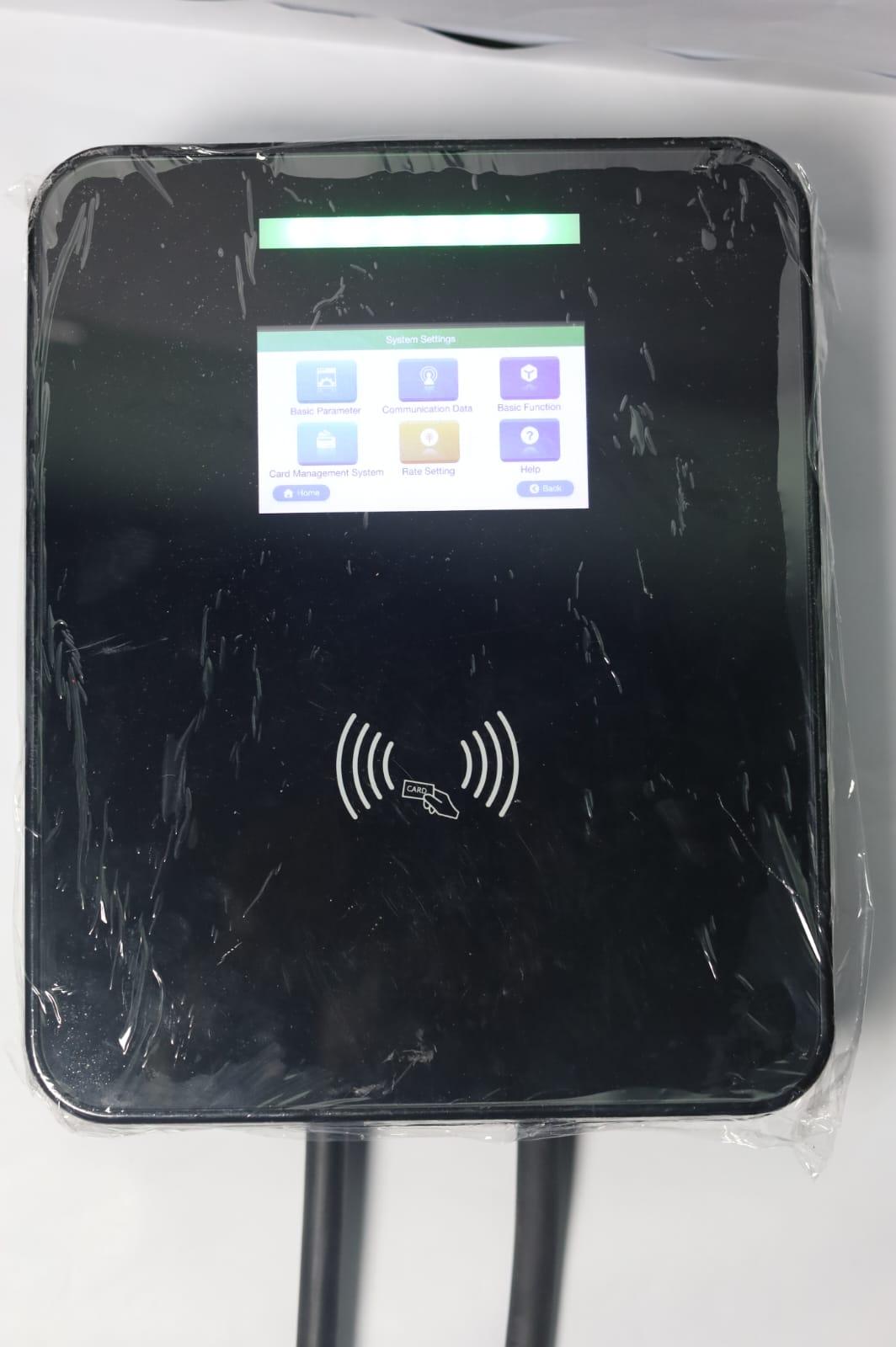 Smart wall-mounted EV charger station with digital screen and RFID card reader interface.