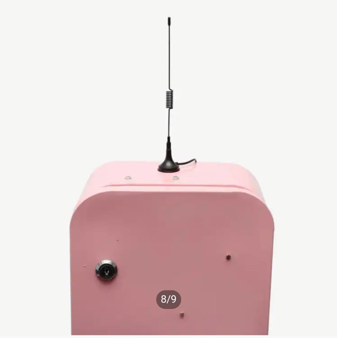 External cellular signal antenna mounted on top of an automated vending machine for wireless network connectivity.