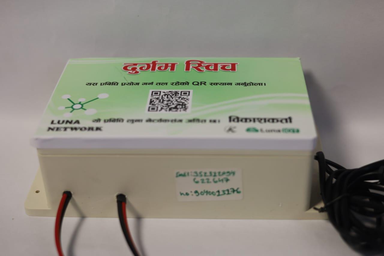 Front view of a wall-mountable IoT switch unit with written device serial information and power cabling.