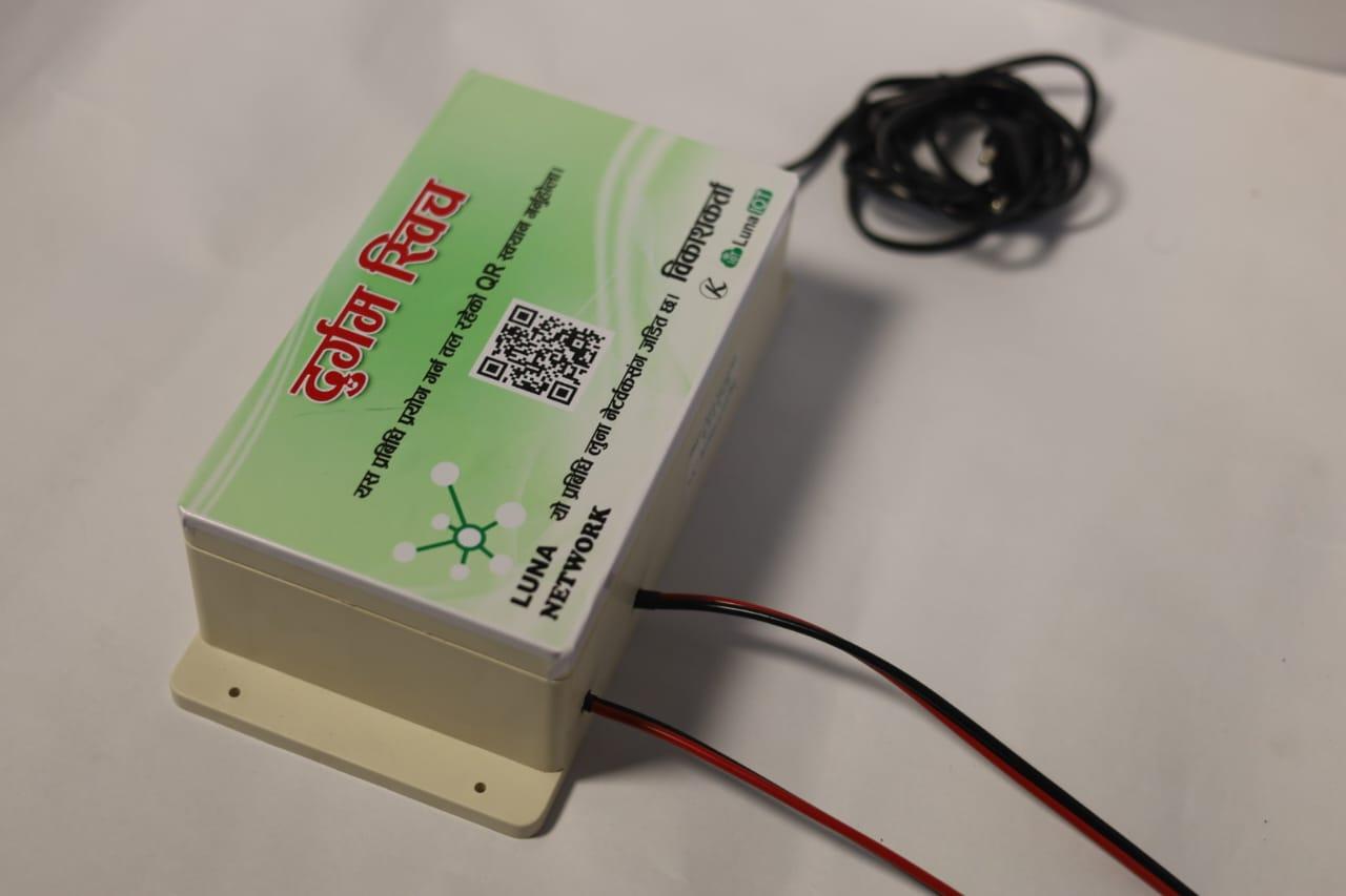 Side perspective of a Luna Network "Durgam Switch" smart controller box with QR code label and power wiring.